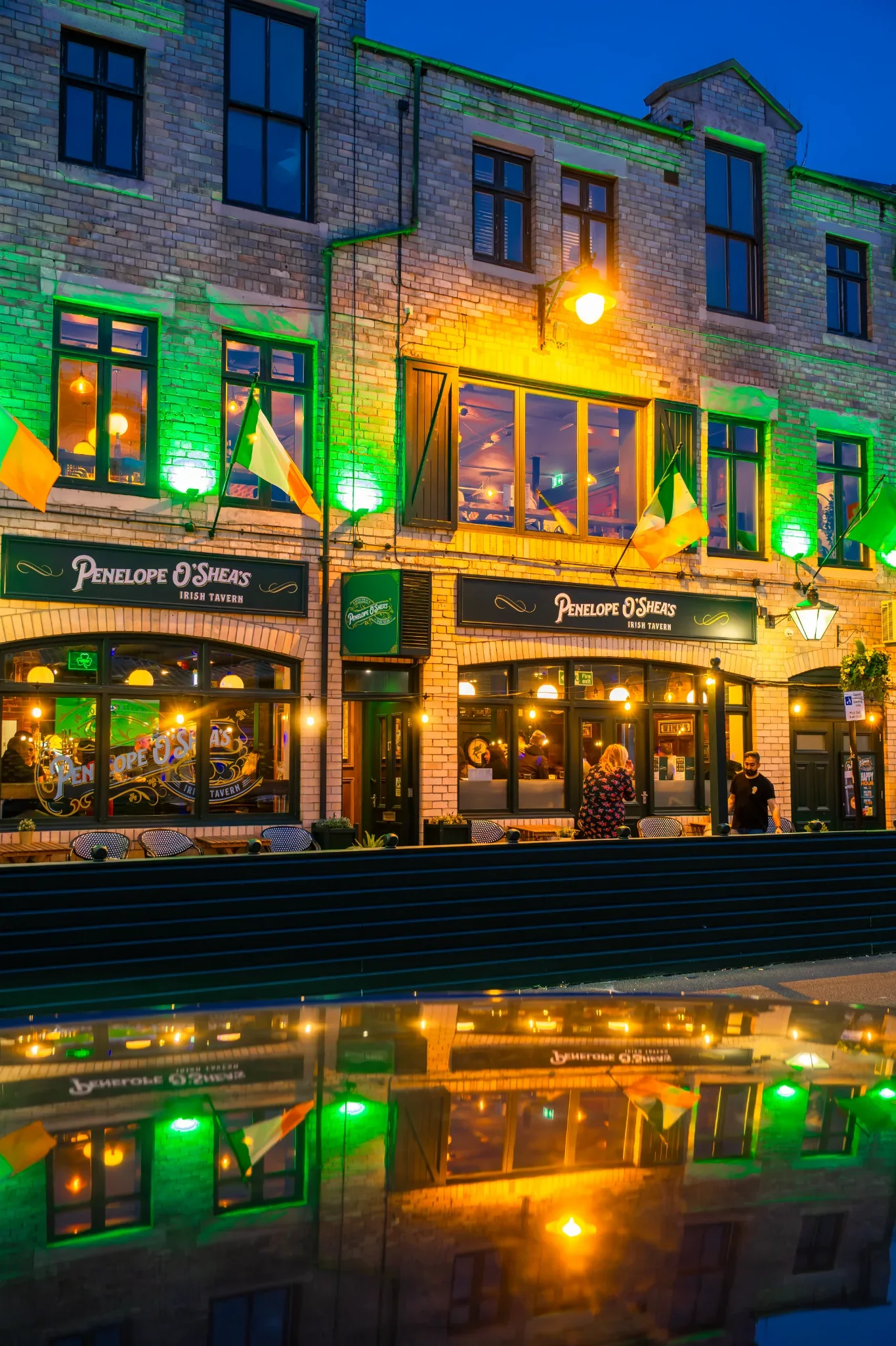 Penelope O'Shea's illuminated exterior on North Shields Fish Quay at dusk