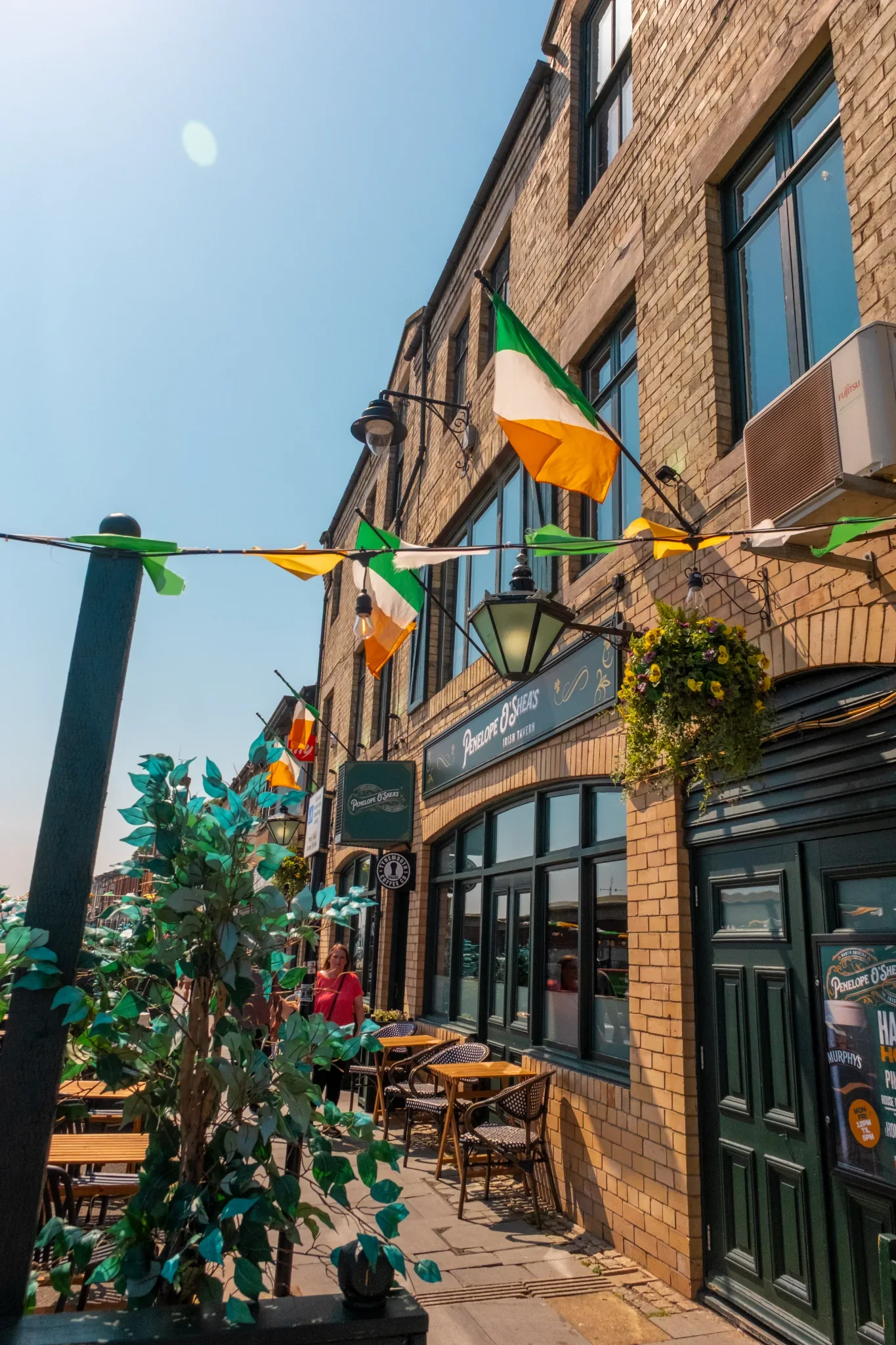 Outdoor seating and Irish flags outside Penelope O'Shea's on the Fish Quay